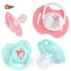A happy baby using a nontoxic silicone newborn pacifier orthodontic BPA-free